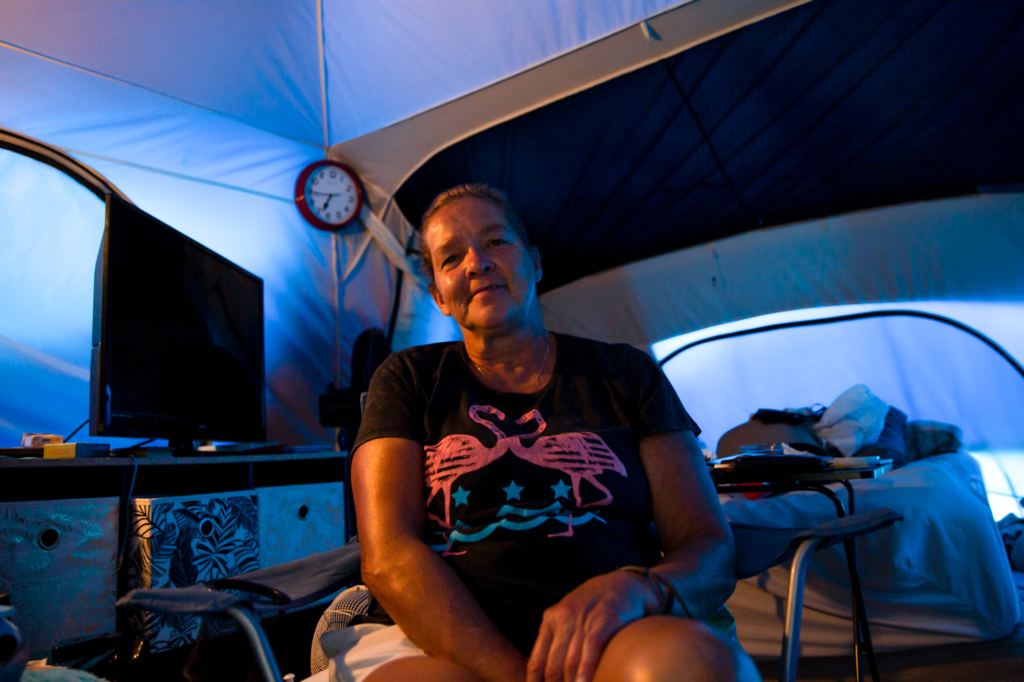 Joyce Buschmann - Joyce Buschmann, whose home was destroyed in Hurricane Michael, now lives in a tent city in Youngstown, Florida. Buschmann's son lives 20 minutes away, but she stays in her tent so as not to burden him. “Why leave when I’m perfectly happy here?” she asked. (Stacy Fernández/News21)