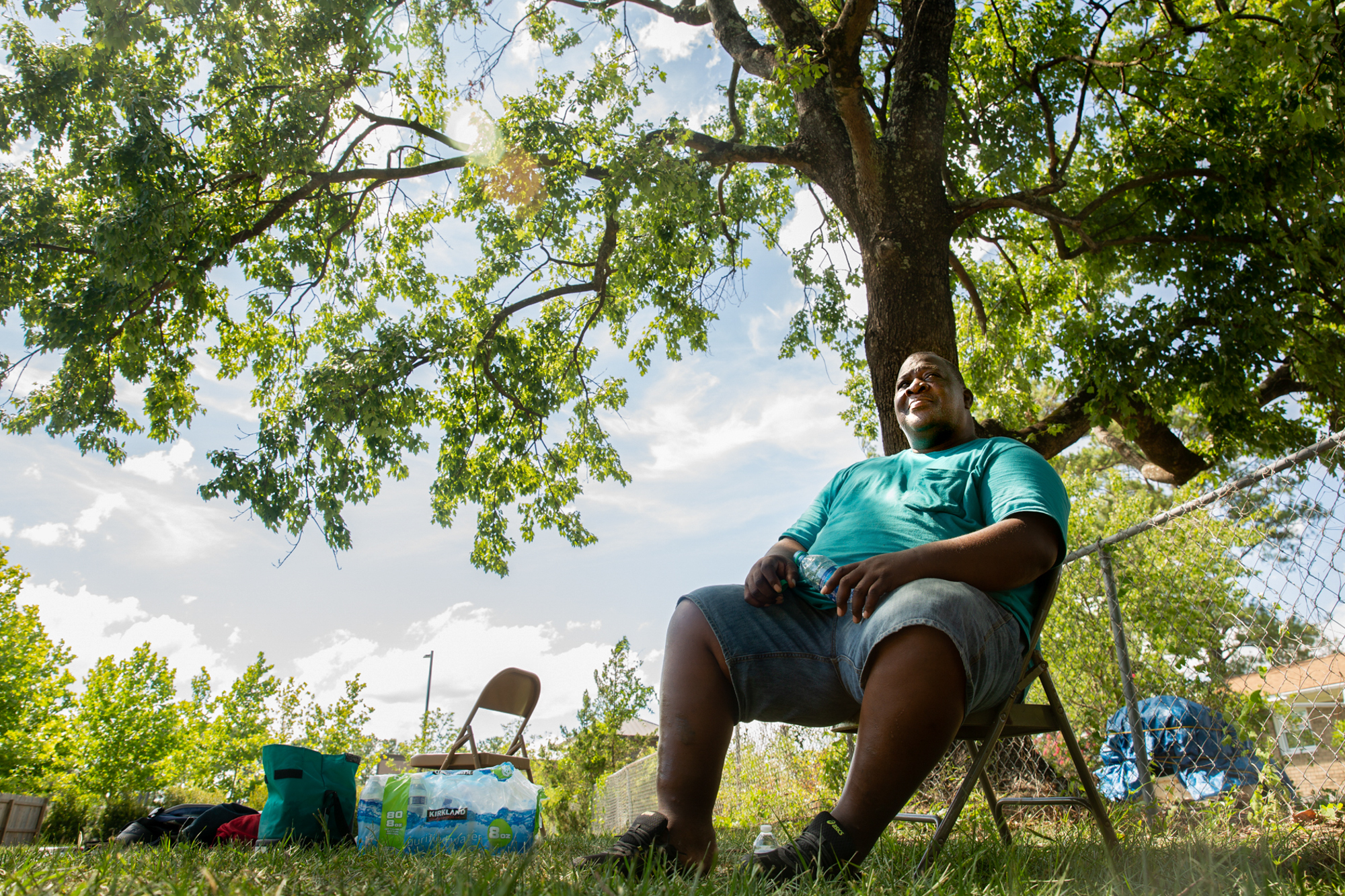 Herman “Leroy” Dukes - Herman “Leroy” Dukes sits under “the tree of knowledge” outside his destroyed family home in Wilmington, North Carolina. After Hurricane Florence, Dukes shuffled between shelters and hotels, and he recently began living on a rug under this tree. “This has taught me to be humble and to be patient,” Dukes said. “And, you know, still keep moving.” (Harrison Mantas/News21)
