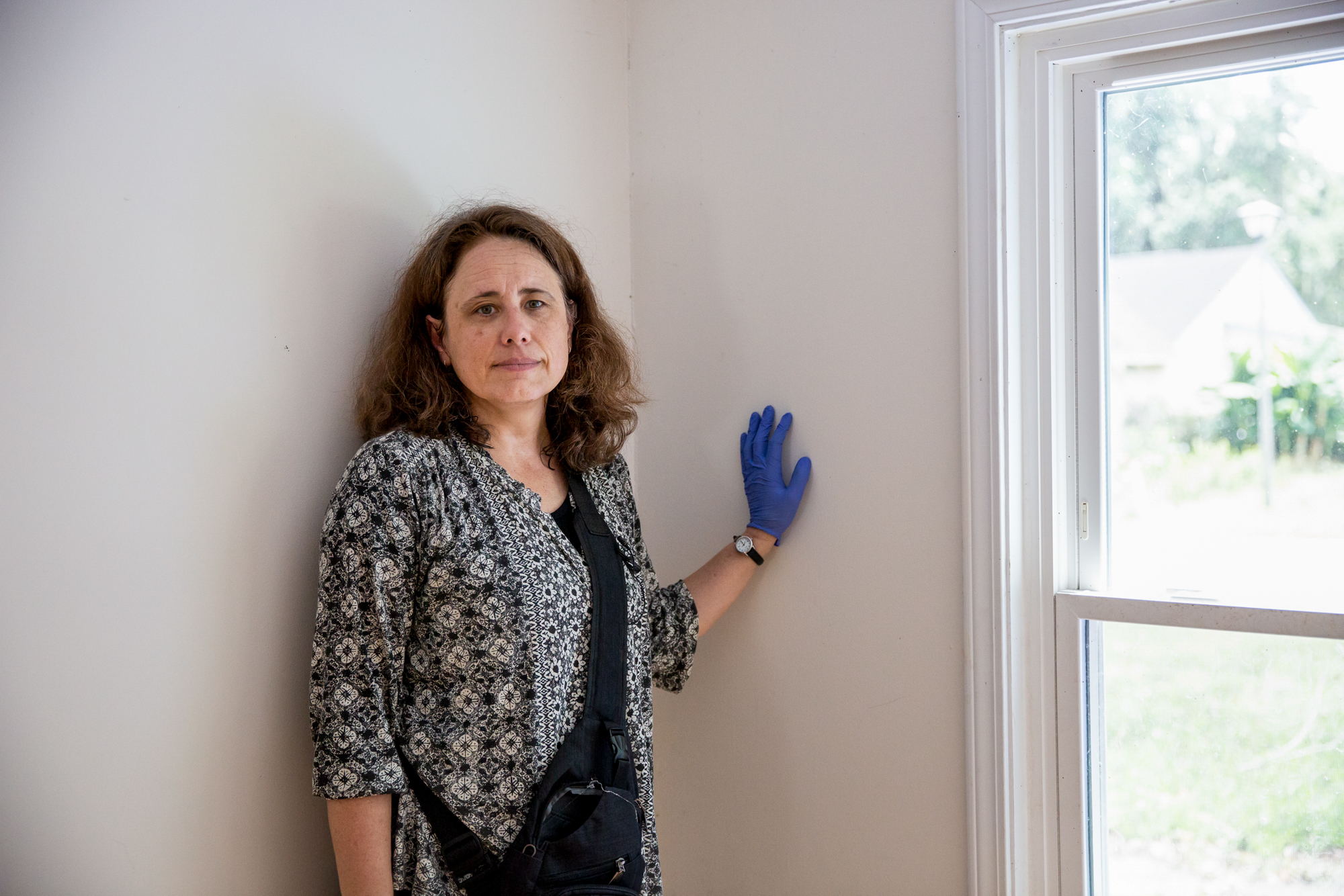 Ana Zimmerman - Ana Zimmerman, an immunologist, discovered mold within the walls of her home after floods in Charleston, South Carolina. “I had my child living in that bedroom for years, and we thought our child had allergies; pollen allergies,” Zimmerman said. “When we ripped open the walls, they were filled with mold.” The mold has gave her child respiratory issues, and after the family moved out in 2017 Zimmerman became an activist for holding the city accountable for failures to follow building codes. (Ellen O'Brien/News21)