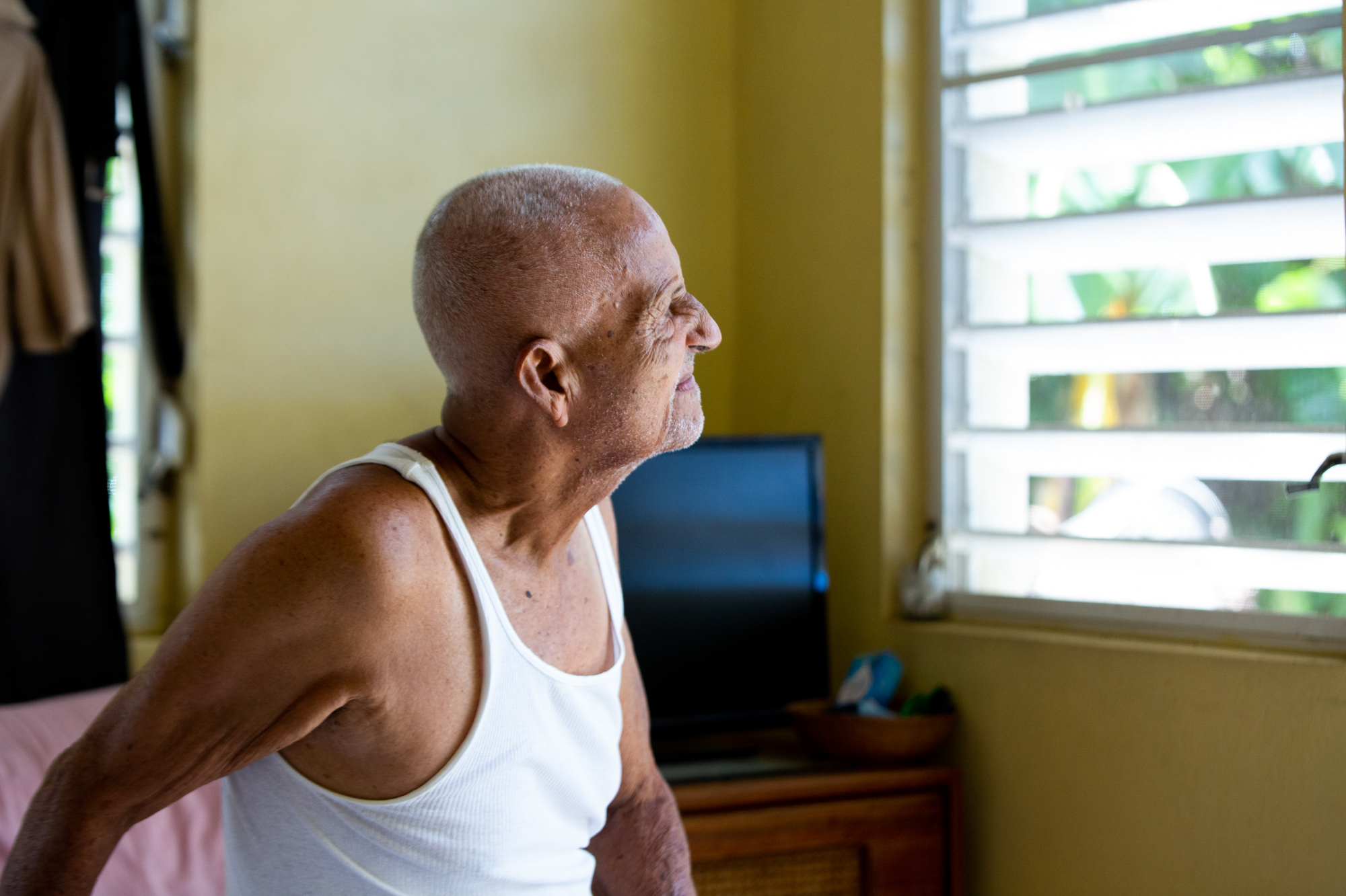 Guillermo Huertas - Guillermo Huertas, 90, has dementia and is living with his wife and daughter in Frederiksted, U.S. Virgin Islands. Although much of their house sustained heavy damage almost two years ago, the family is reluctant to move. (Anya Magnuson/News21)