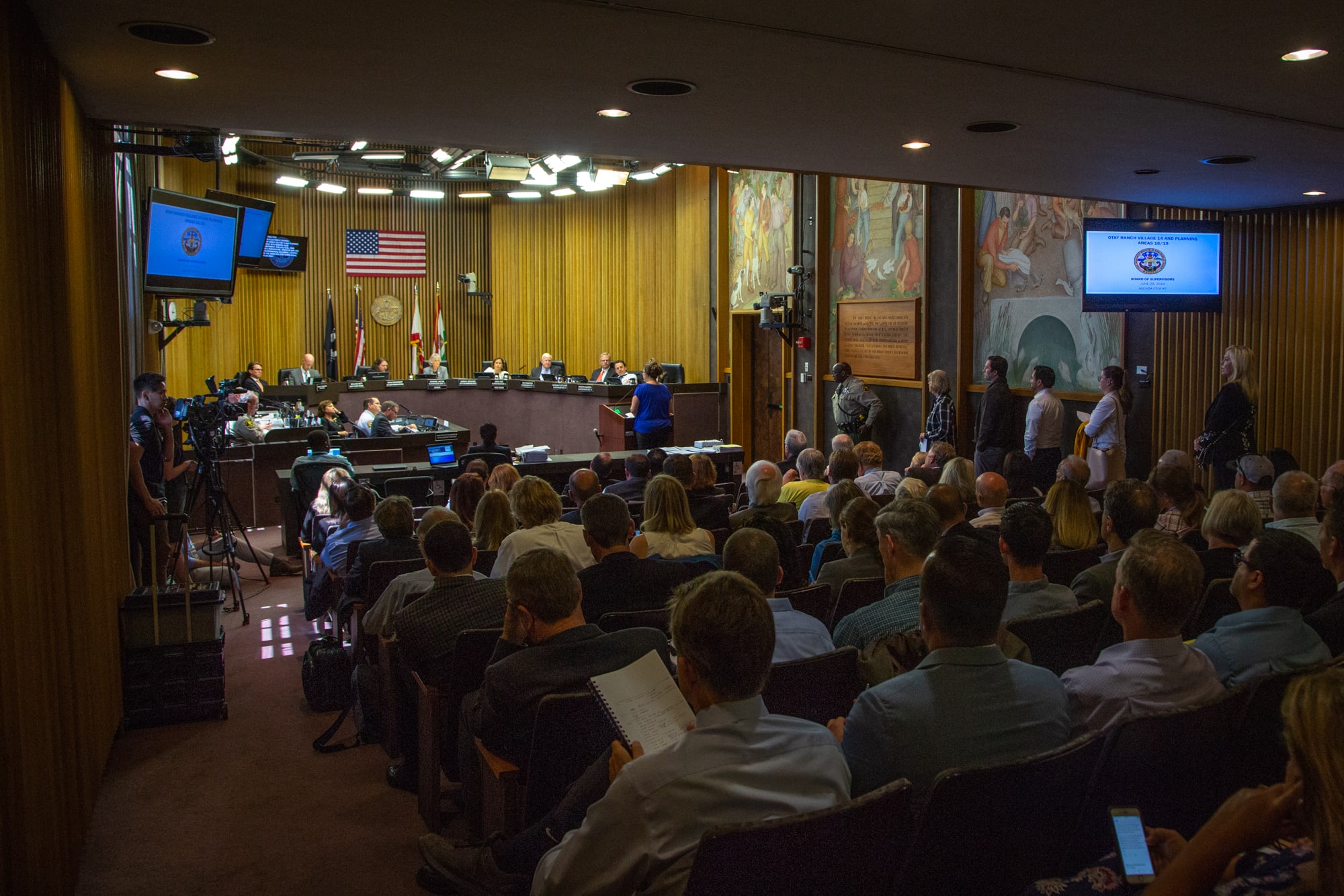 San Diego County residents line up to comment on a proposed housing development in an area that has burned every seven years on average since 1950. The development was approved. (Kailey Broussard/News21)