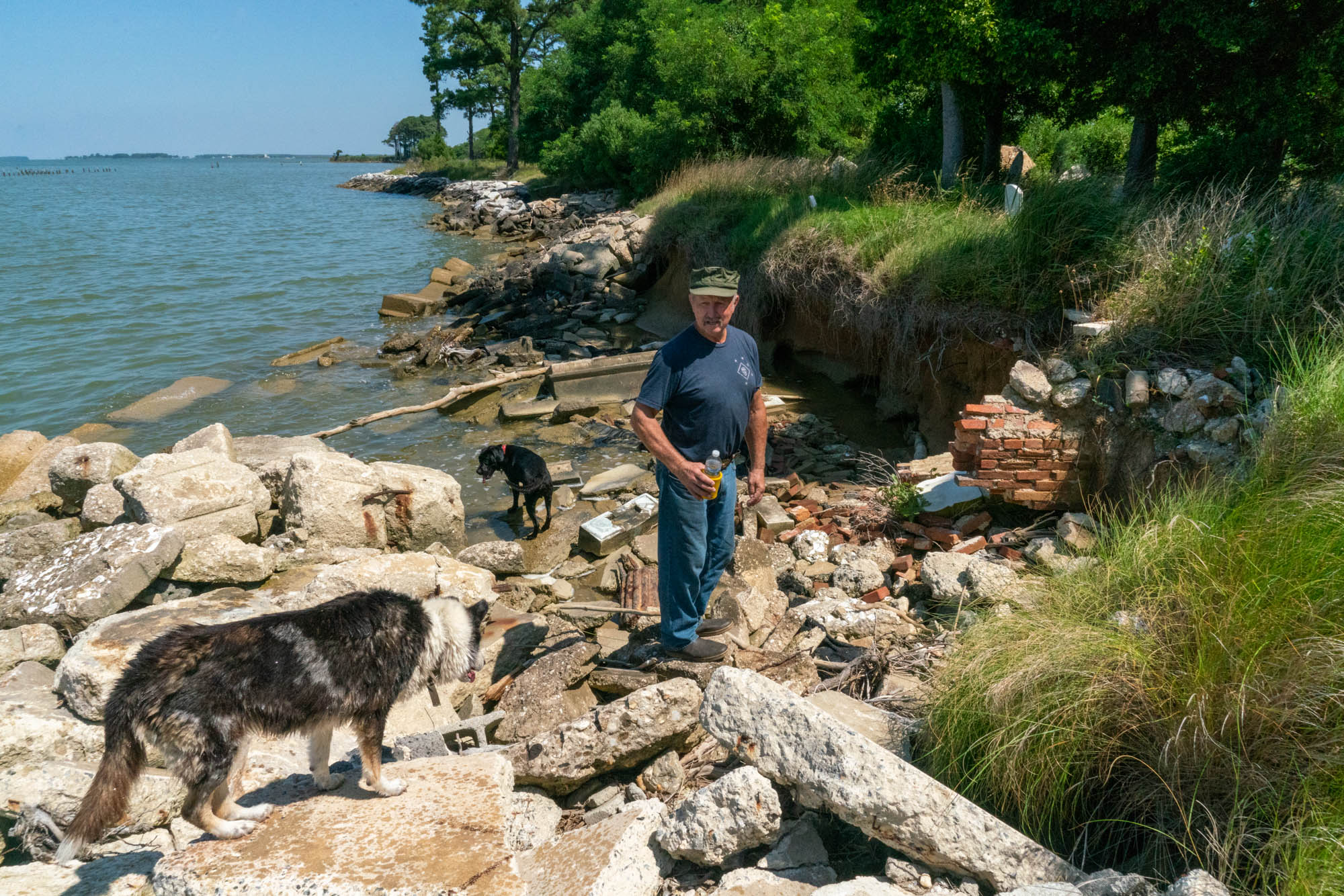 Donald Willey of Hoopers Island, Maryland, has spent 17 years trying to save the tombs and headstones of his island’s ancestors from falling into the Chesapeake Bay. He has placed rocks on the shoreline to keep the water back, but it continues to seep through the barriers. (Jordan Laird/News21)
