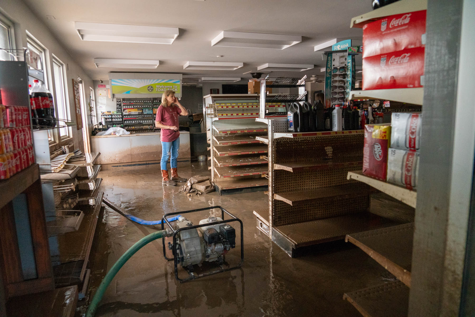 The Arkansas River overflowed its banks this year, though Jason and Christy Trantina, owners of the Toad Suck One-Stop, tried in vain to stop the deluge with concrete blocks. (Jordan Laird/News21)