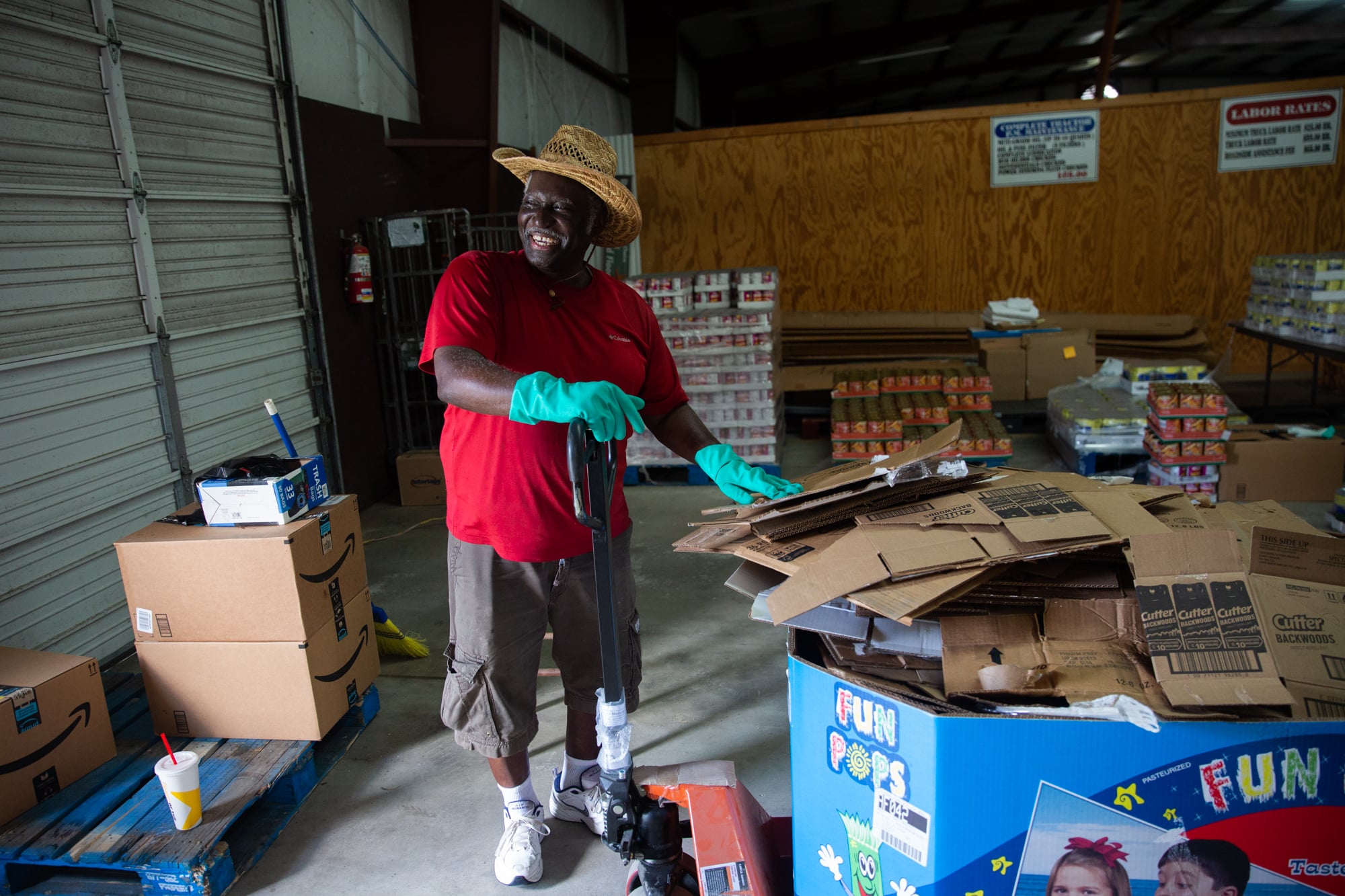 Jerry Rivers, 63, breaks down boxes in the warehouse for the Dillon County Long Term Recovery Group in Dillon, South Carolina. It’s one of several grassroots groups developed to help communities recover from disasters when government programs aren't available or can’t meet the need. (Harrison Mantas/News21)