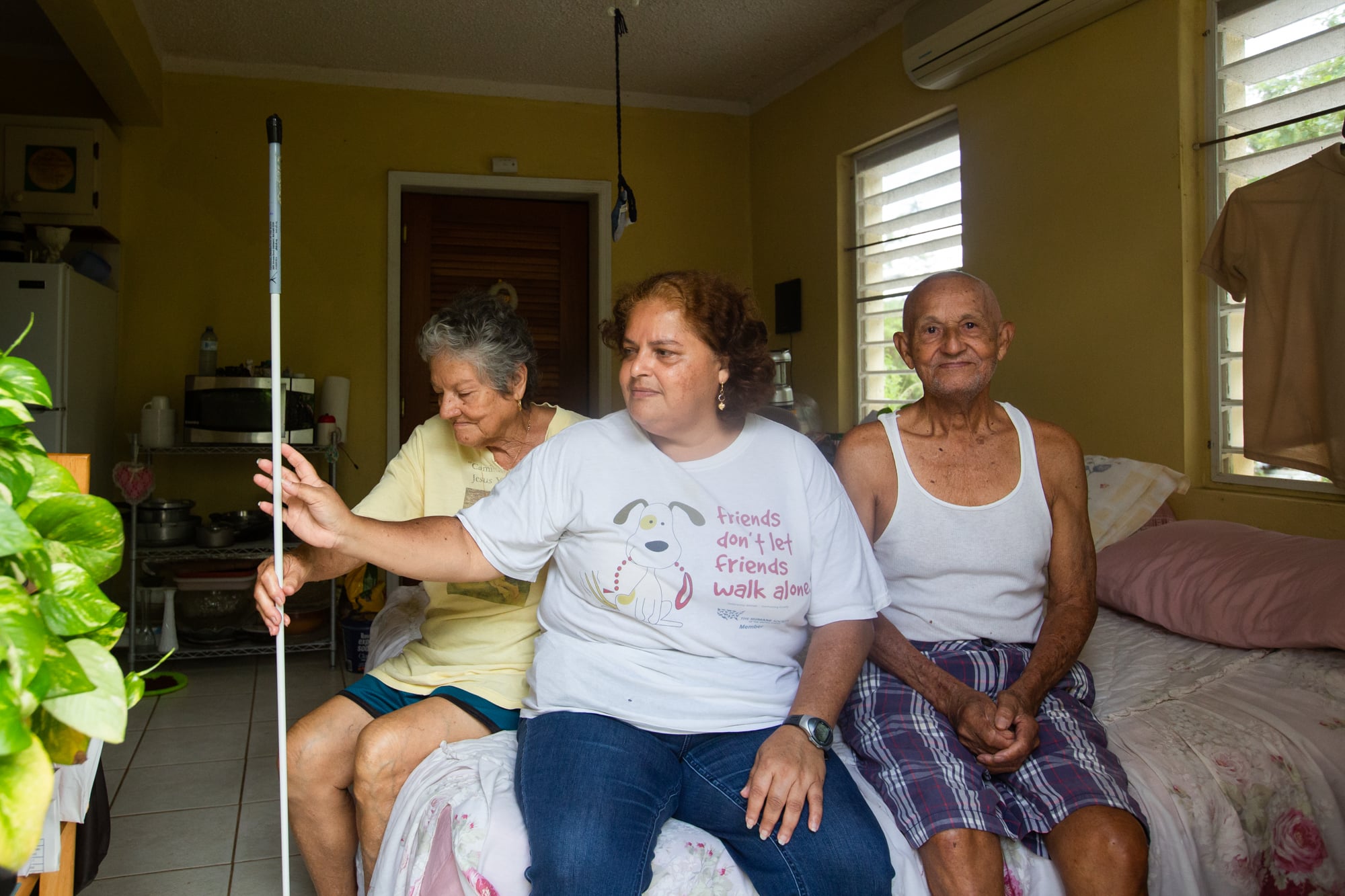 Norma, Carmen (center) and Guillermo Huertas estimate repairs to their home will cost $120,000; so far, they've gotten $27,000 from FEMA. (Anya Magnuson/News21)