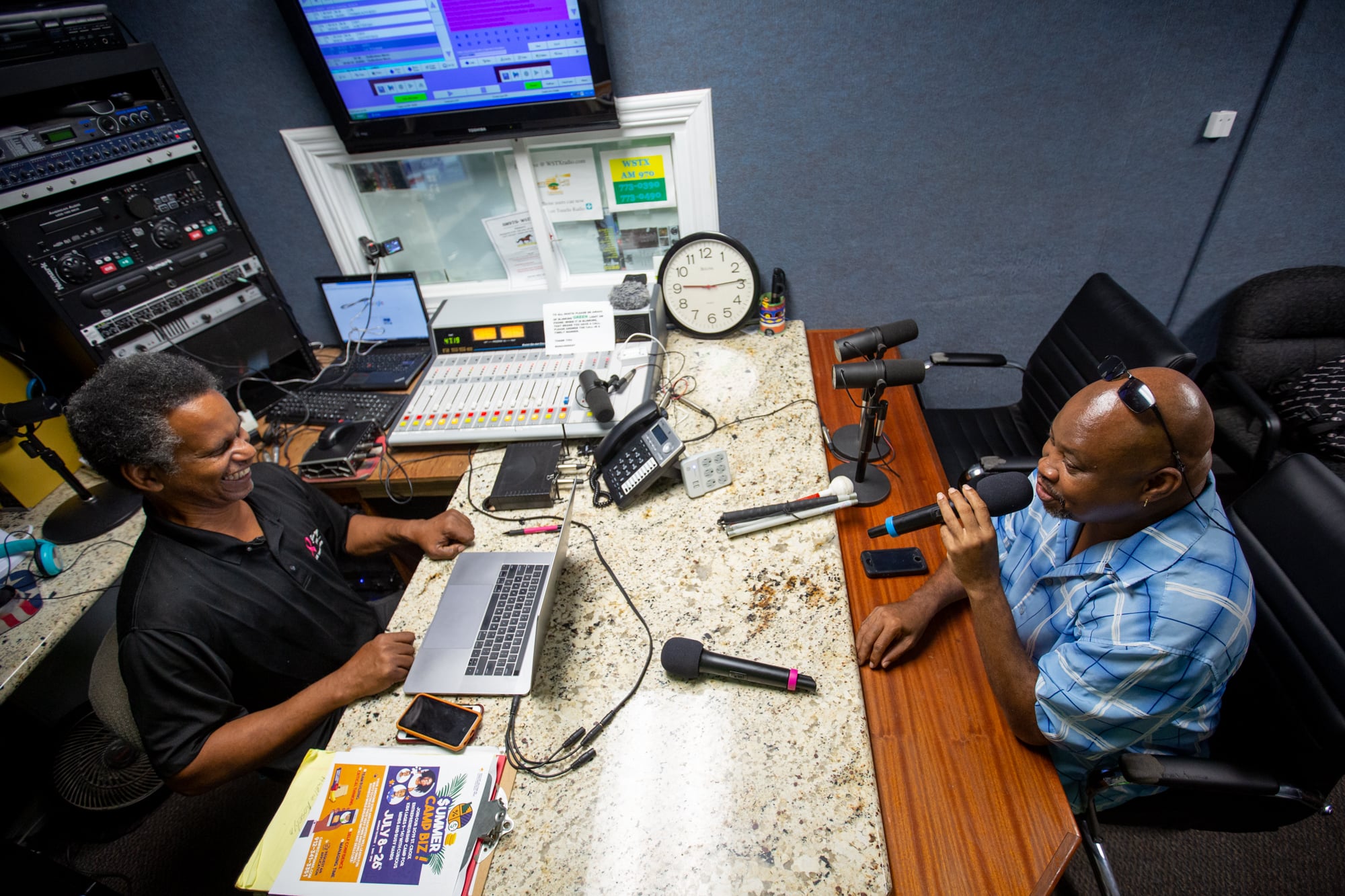 Gerard Evelyn (right) speaks with Doug Canton of WSTX radio on a show called “Reflections” on St. Croix. During the 2017 hurricane season, Evelyn said, radio was invaluable for communication. (Anya Magnuson/News21)