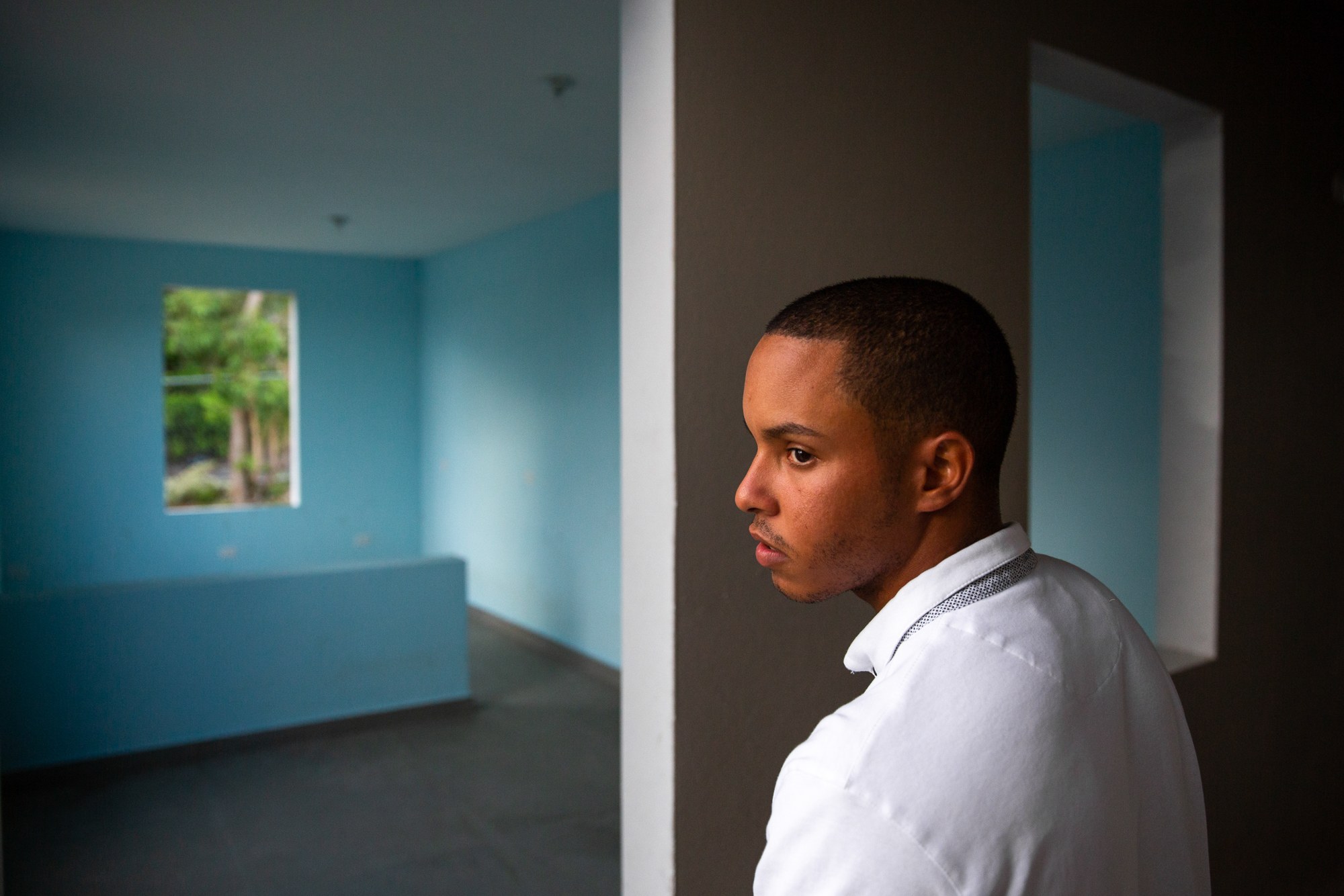 Omar Charriez - Omar Charriez, 22, has lived at the Forjadores de Esperanza shelter in Puerto Rico for nine years. During Hurricane Maria, the shelter lost its roof and Charriez helped the other boys stay calm. After the storm was over, Charriez worried about the shelter’s future. “I was thinking ‘What is going to happen now?’” he recalled. “If the shelter is actually going to close, what is going to happen with the kids?” (Ellen O’Brien/News21)