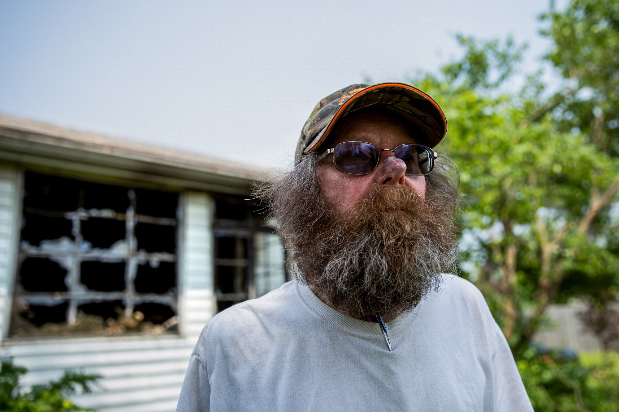 Kirby Schumacher - Kirby Schumacher of Beavercreek, Ohio, remembers feeling lucky after tornadoes in May missed his house. But six days later, after power was restored to his neighborhood, his house caught fire due to a suspected electrical fire. Schumacher had forgotten to turn off the breaker and was not home when the power came back at 5:15 p.m.; in 15 minutes, firefighters were outside his house. (Stacy Fernández/News21)