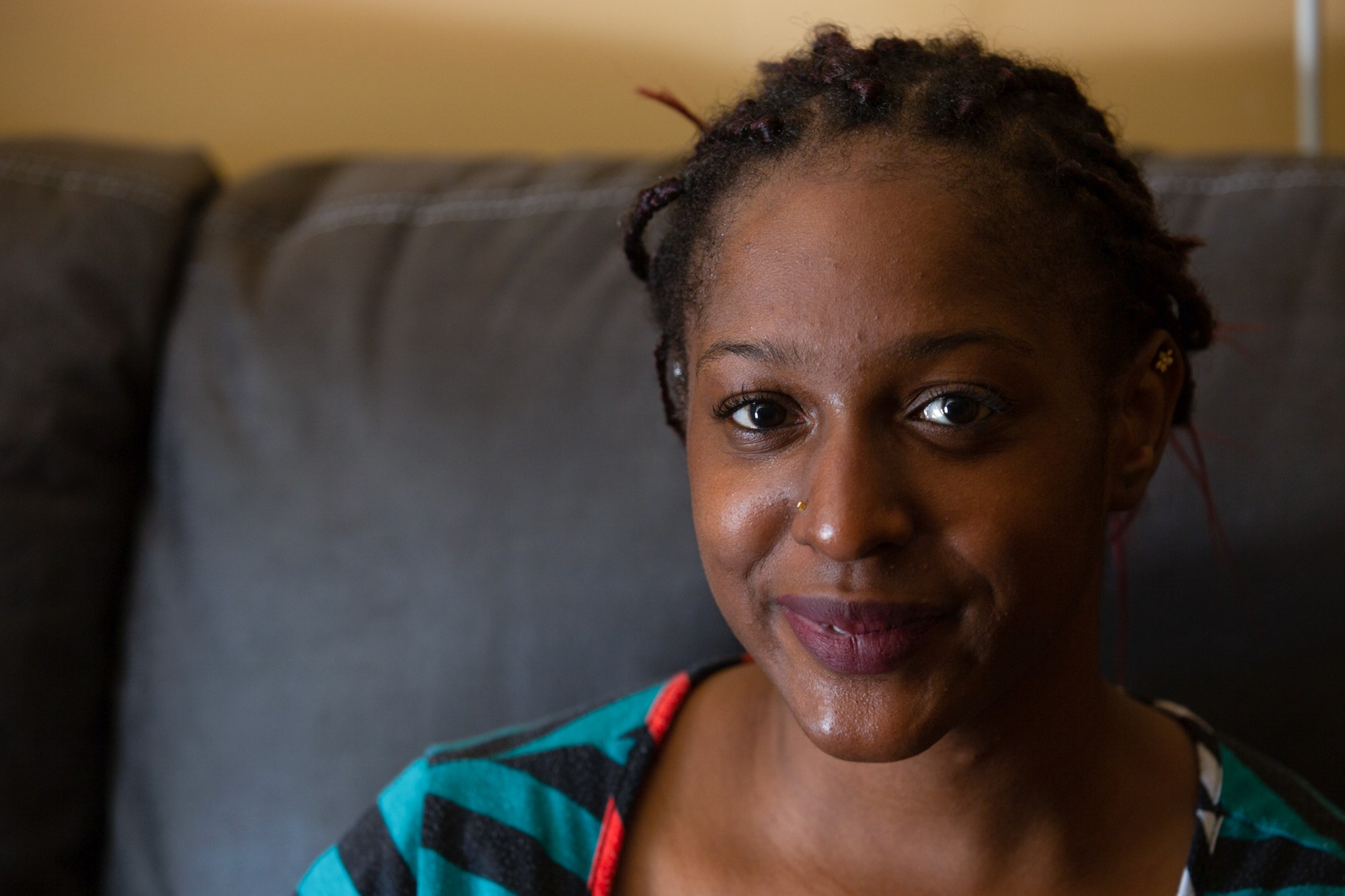 Naomi Davis - Naomi Davis, 24, a single mother in Fayetteville, North Carolina, was forced to move out of her storm-damaged trailer because she has no way to pay for repairs. Davis, who has a blood clotting disorder and needs open heart surgery, has since moved into a new trailer with assistance from the Cumberland Disaster Recovery Coalition. (Harrison Mantas/News21)