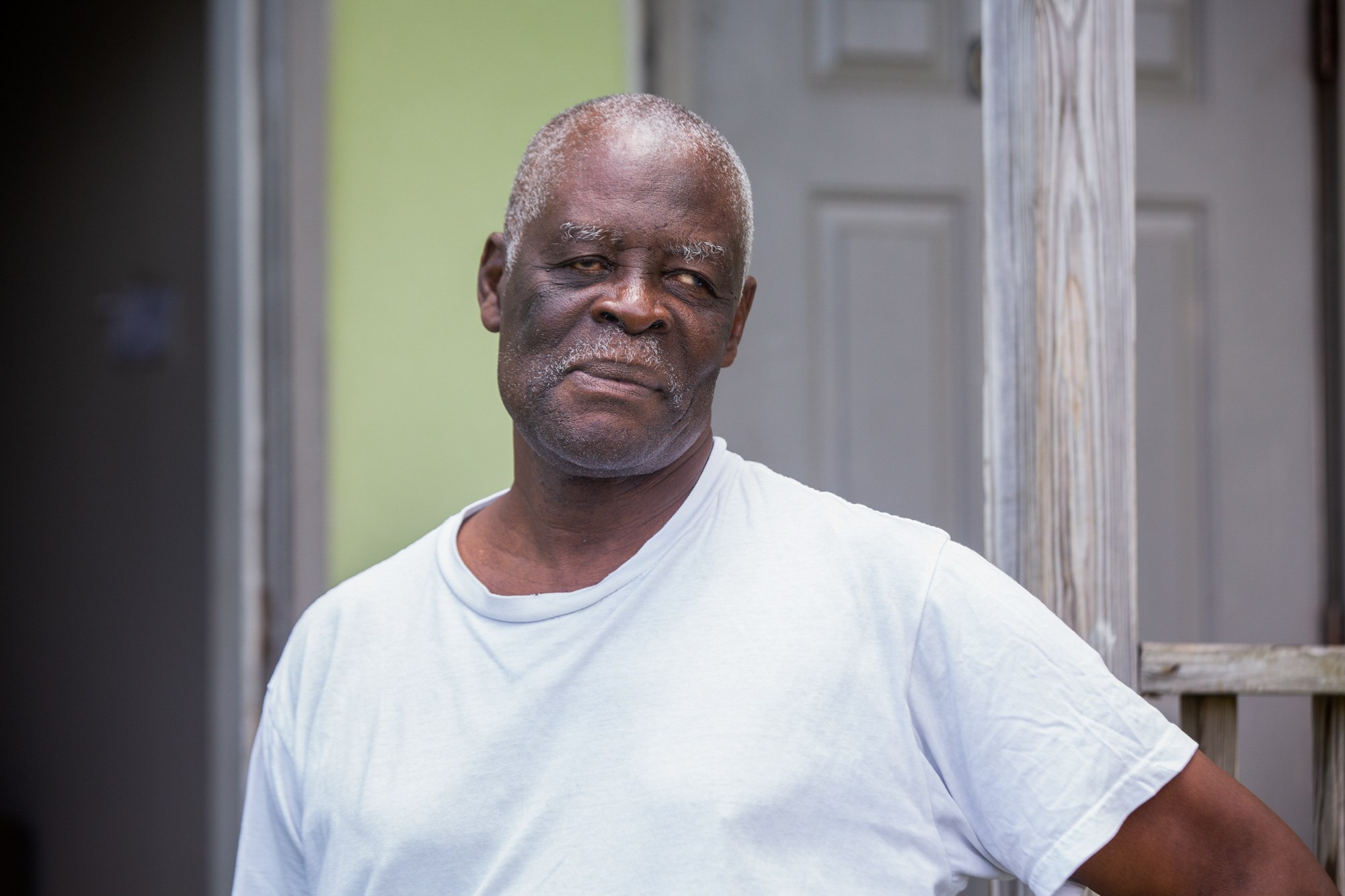 Claudius Prosper - Claudius Prosper, a blind man in Frederiksted, U.S. Virgin Islands,  lives in an apartment that still has flood damage from the 2017 hurricane season. The apartment above theirs was abandoned due to water damage, but Prosper and his wife say FEMA investigators never came to assess the damage to their apartment. (Anya Magnuson/News21)