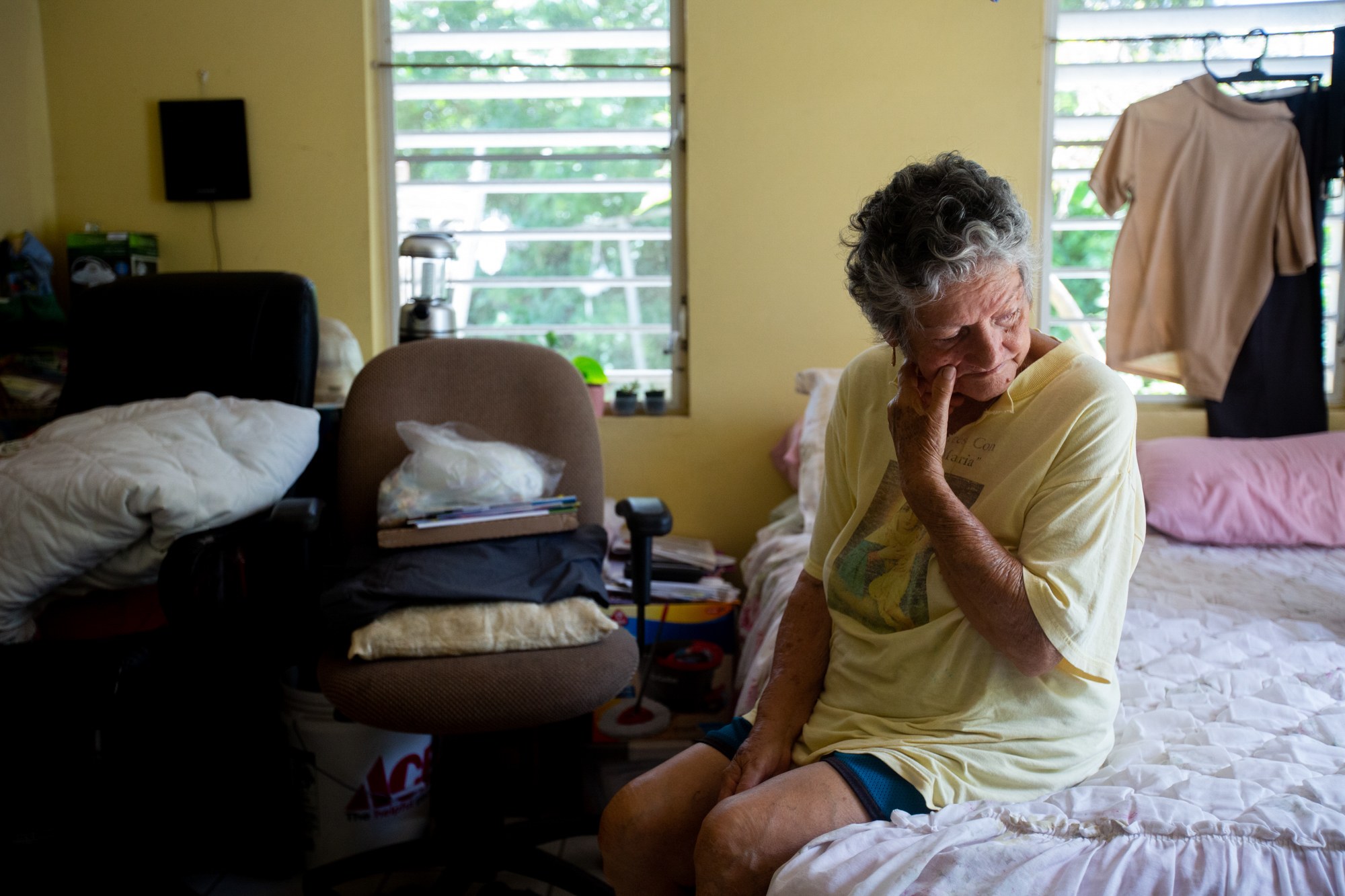 Norma Huertas - Norma Huertas, 82, still lives in her mostly destroyed home in Frederiksted, U.S. Virgin Islands, since the 2017 hurricane season. Huertas doesn’t want to move because their neighbors know to keep an eye out for her husband, Guillermo, who has dementia and a tendency to wander. (Anya Magnuson/News21)