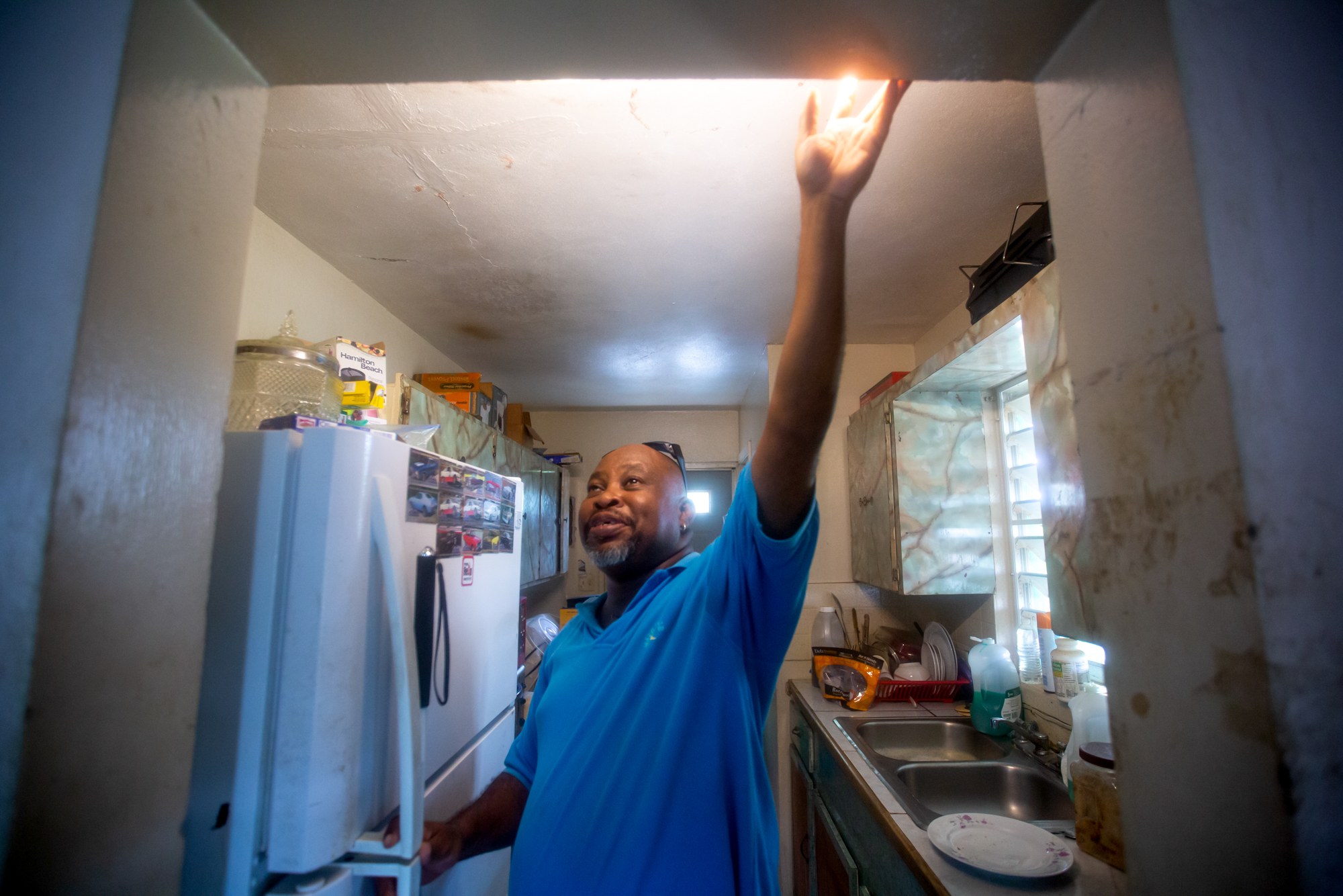 Gerard Evelyn - Gerard Evelyn, 49, lost his vision six years ago to a complication of diabetes. His home in Frederiksted, U.S. Virgin Islands, still has water damage from Hurricane Maria. Evelyn, who lives alone, thinks the government tends to disregard younger people with disabilities. During the 2017 hurricane season, Evelyn didn’t have electricity to keep his insulin cold and charge his iPad, which he uses to help navigate without vision. (Anya Magnuson/News21)