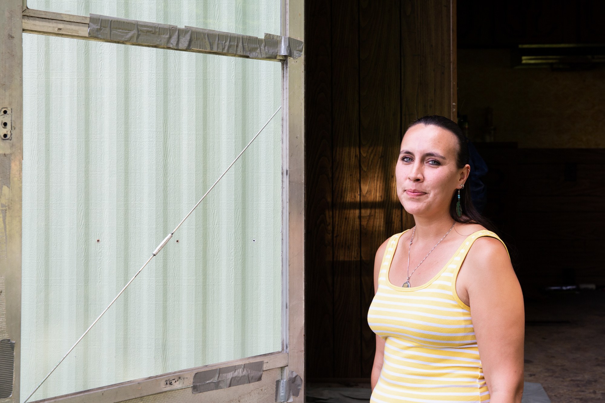 Robin Rich - Robin Rich, a member of the Ponca Tribe of Nebraska, is one of the few people in Verdigre whose home was a total loss after March floods. Because her trailer home had been a gift from her parents, Rich struggled to prove to FEMA that she was the owner, and she went through the appeals process three times to receive aid. Three months after the flood waters receded, she still hadn’t gotten her destroyed trailer removed. (Anya Magnuson/News21)