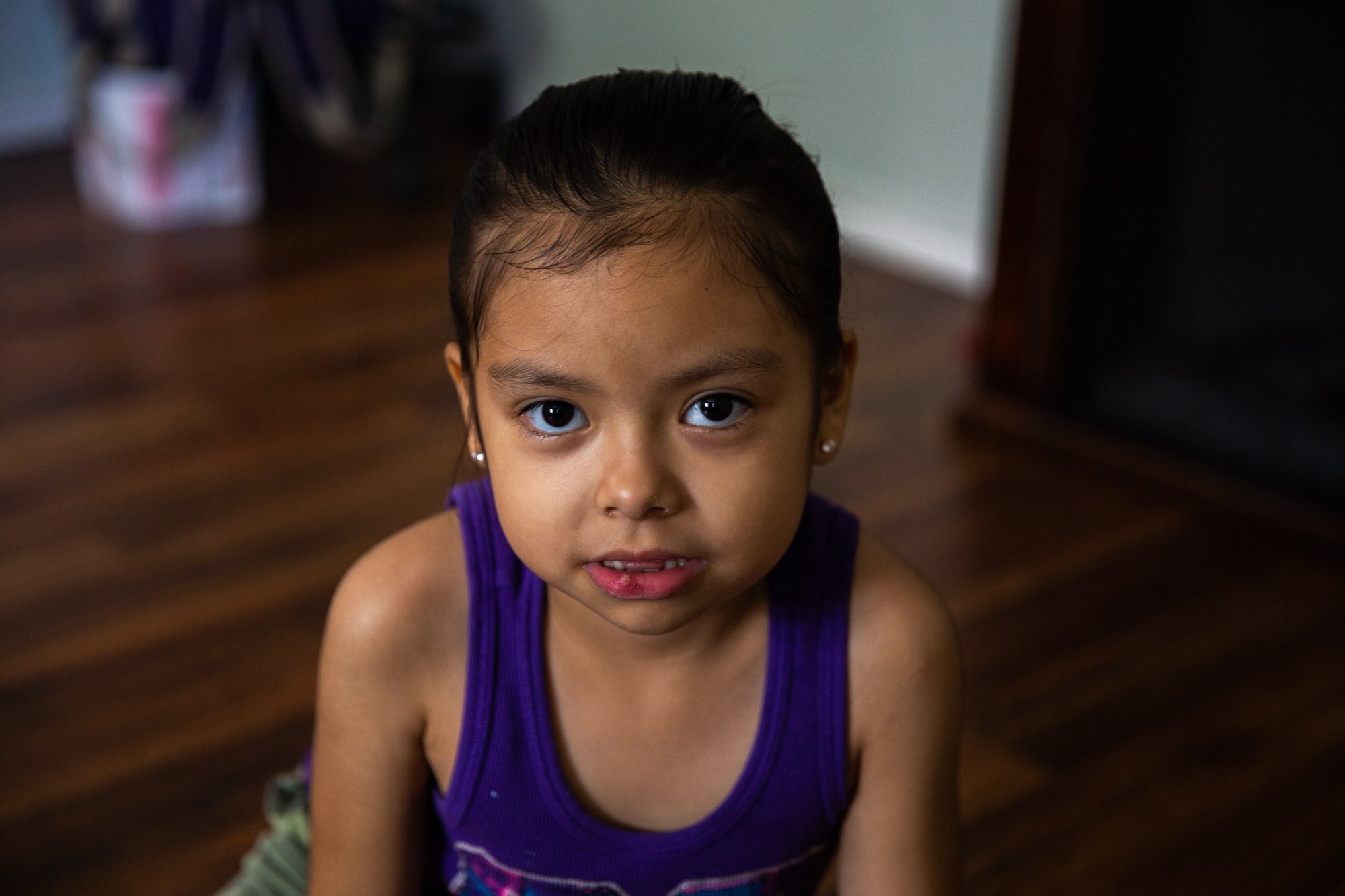 Ester Escobedo - Ester Escobedo’s mother, Ruth Escobedo, worries that the poor condition of her house will negatively affect the health of her two daughters, Ester, 6, and Mia, 1. Hurricane Harvey damaged the foundation and left behind mold, cracked floorboards and uneven concrete pathways. (Rachel Farrell/News21)