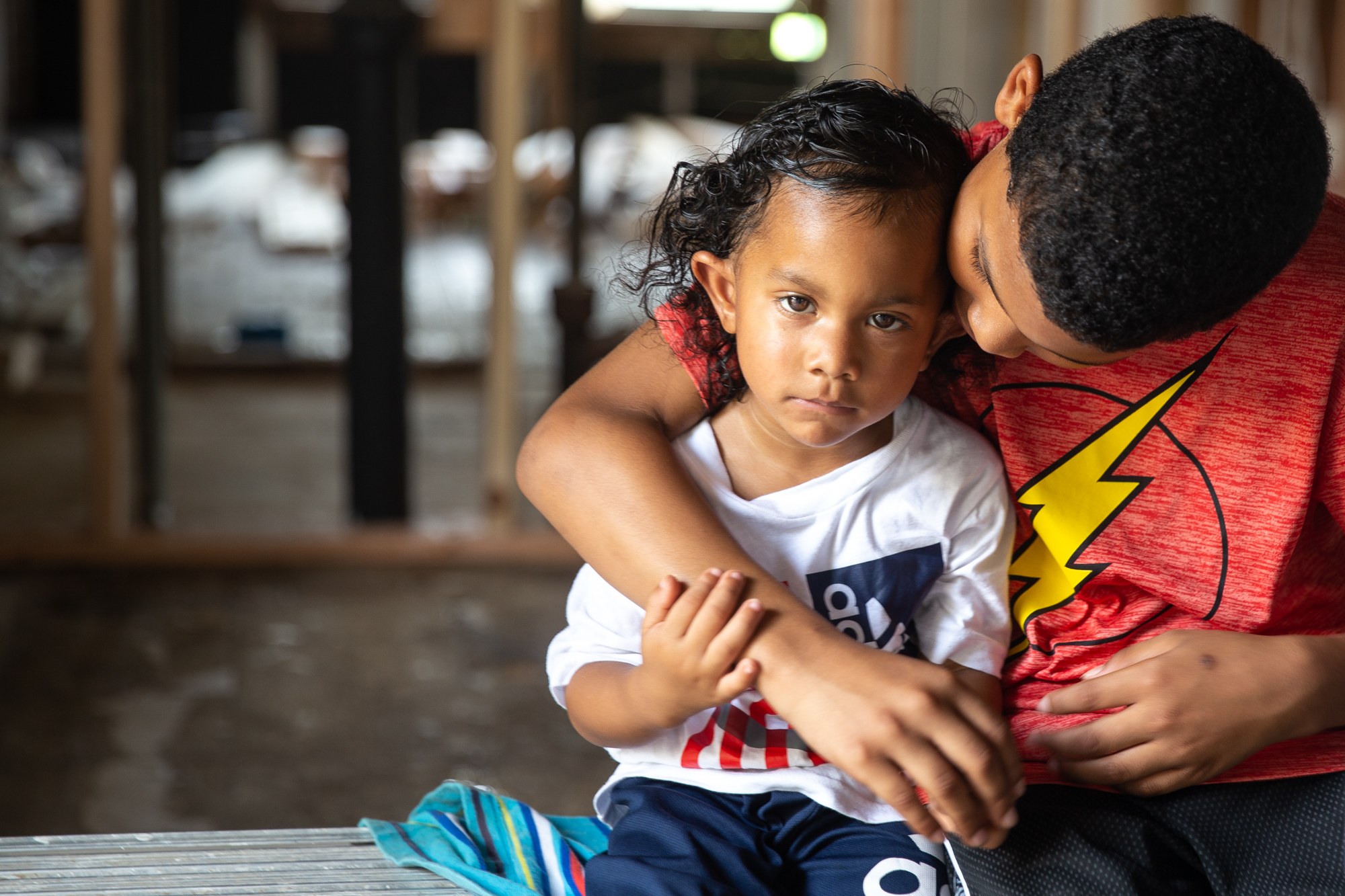 Alonzo and Walter Beal - Alonzo Beal, 11, and his 3-year-old brother, Walter, are part of a family of six living in a two-bedroom home in Houston since Hurricane Harvey destroyed their house and all their belongings. The family did not receive enough money from FEMA to repair their house, instead squeezing into the much smaller place next door. (Rachel Farrell/News21)