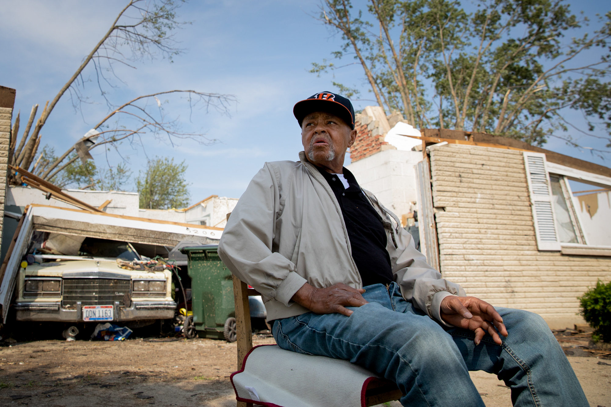 Charles “Smitty” Smith - After a series of tornadoes in Ohio in May 2019, Charles “Smitty” Smith, 76, was trapped under his wooden bedframe. All he could see was a tree and bits of sky. His roof was gone, but his 50 or so suits remained in the closet, and pictures of his mother and father still hung on the wall. Even though Smith's home in Trotwood is unlivable, he has to make payments on it until 2025. He thought his insurance would pay it off but discovered “it doesn’t work like that.” (Stacy Fernández/News21)