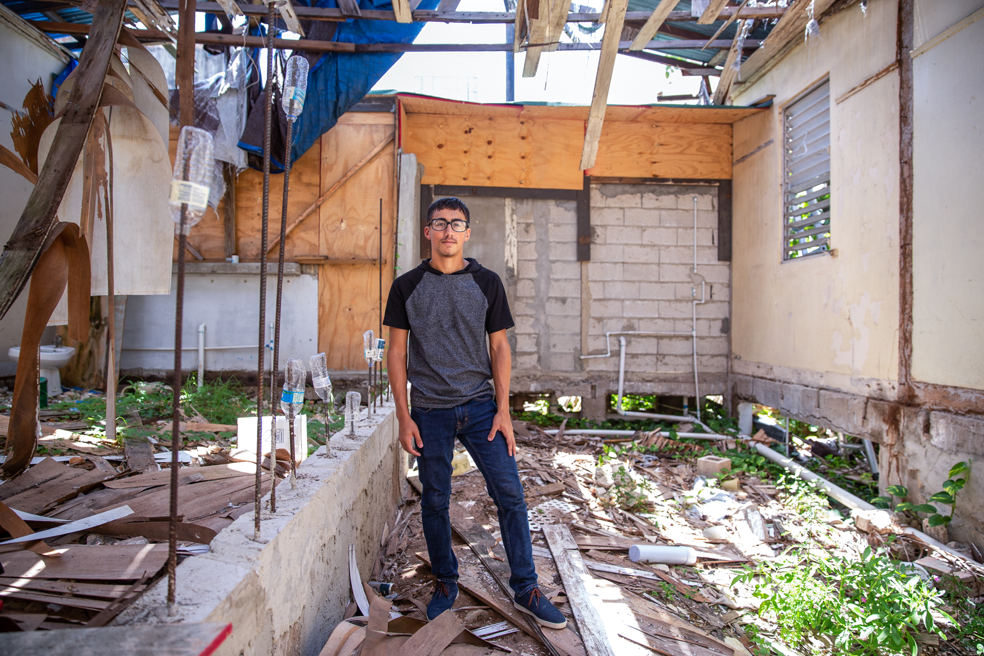 Ángel Morales Jr. - Ángel Morales Jr. turned 18 in September 2017, three days after Hurricane Maria destroyed his family's home in Puerto Rico. Nearly two years later, the family has received little government assistance to repair their home and has had their electricity cut off due to overdue bills. (Ellen O'Brien/News21)