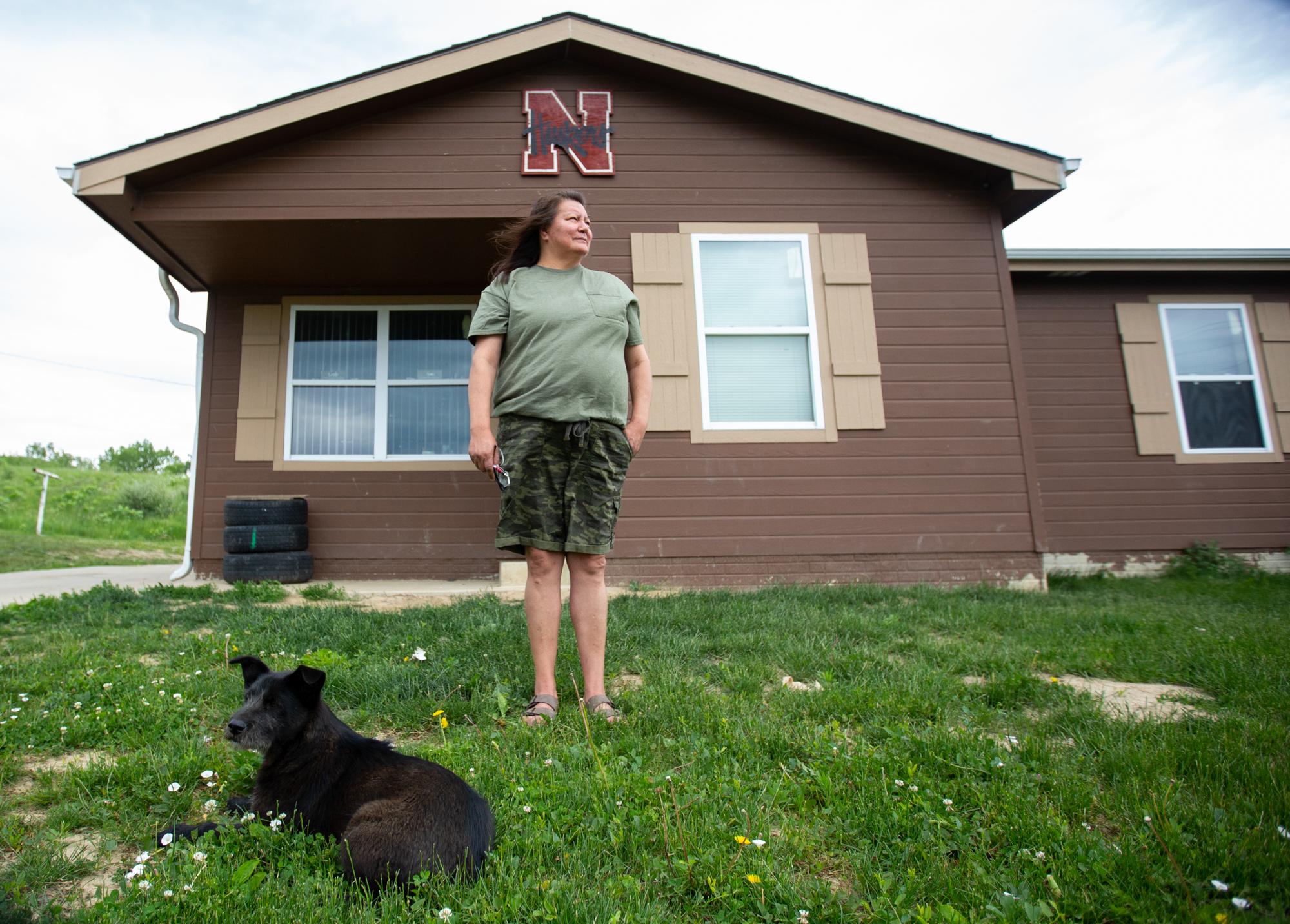 Debra Grant - Debra Grant, a member of the Omaha Tribe of Nebraska, lost her home to floods in 2011. She and her family spent five years living in a temporary home with mold damage, but they recently moved into a permanent home with two of her children and five  grandchildren. But in March 2019, the Missouri River flooded, filling the basement of her new home with water, even though she had moved to higher ground. (Anya Magnuson/News21)