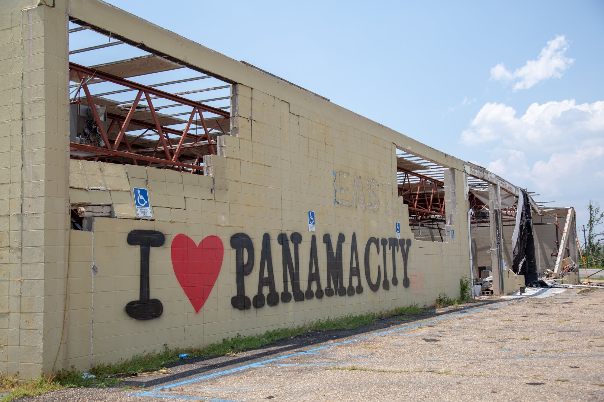 This graffiti on a destroyed building welcomes passerbys into Panama City, Florida. (Peter Nicieja/News21)