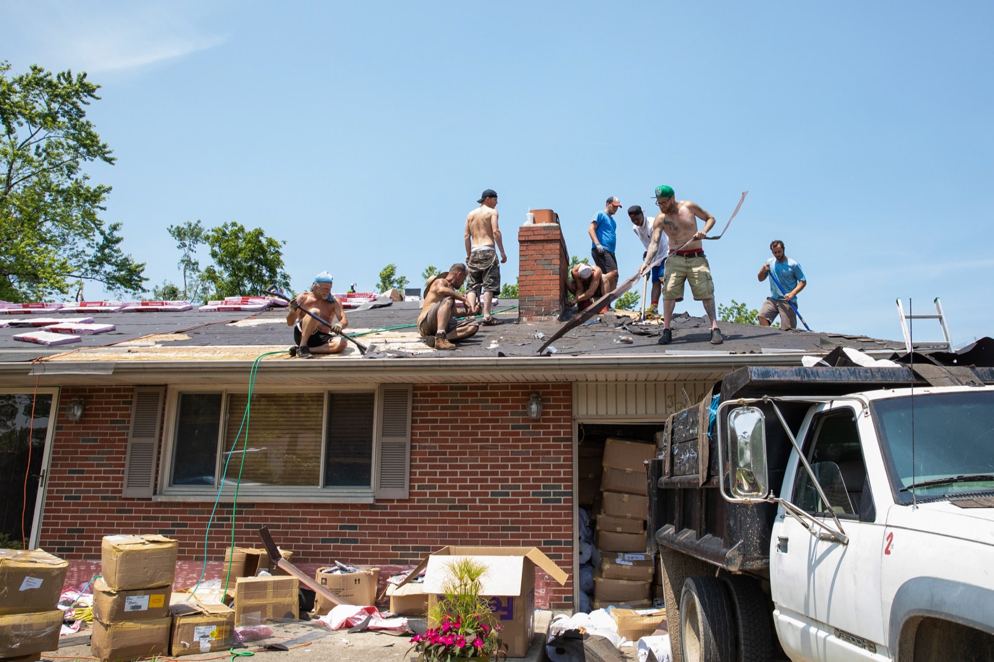 Contractors repair a roof in Beavercreek, Ohio, which was hit by an EF4 tornado in May. (Stacy Fernández/News21)
