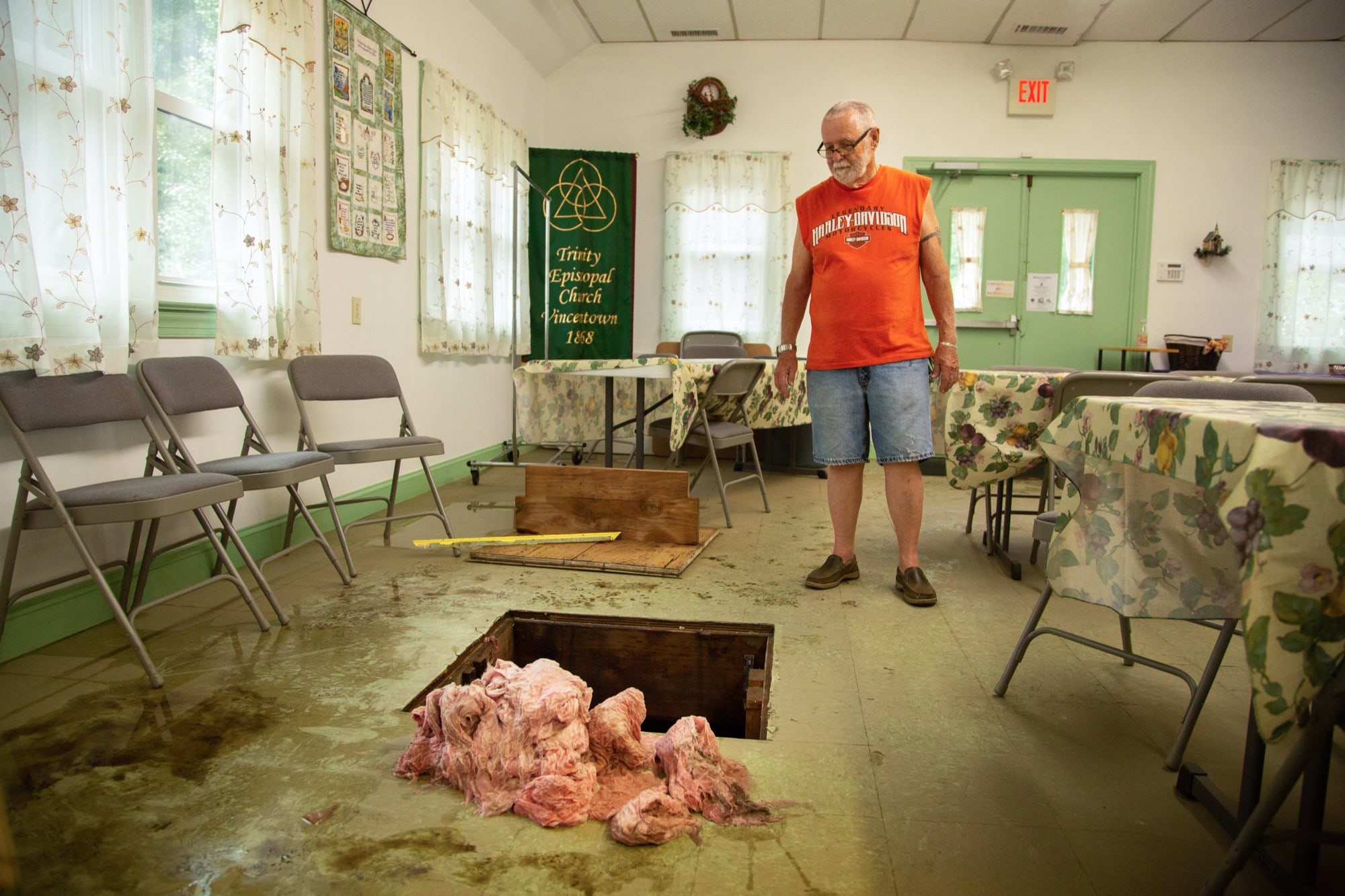 Tom Bridge, 82, is the parish administrator of Trinity Episcopal Church in Vincentown, New Jersey. Flooding this summer caused extensive damage to the church hall, where a pile of soggy insulation remained weeks later. (Allie Barton/News21)