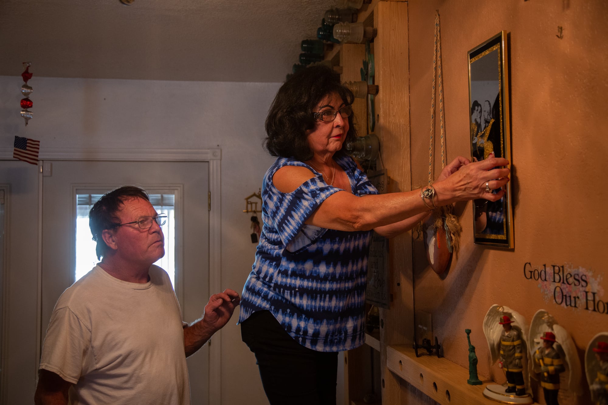 When Pat and John Spencer returned to their home in Roosevelt, Arizona, after a five-day evacuation, three firefighter figurines were among the first things Pat unpacked. She has six firefighters in her family; three of them – her son, husband and nephew – spent more than a week battling the Woodbury Fire in June. (Anton L. Delgado/News21)